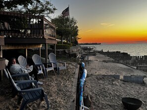 On the beach, sun loungers, beach towels - Beachfront lake house with large deck, beach bonfire & stunning views!  (Pigeon)