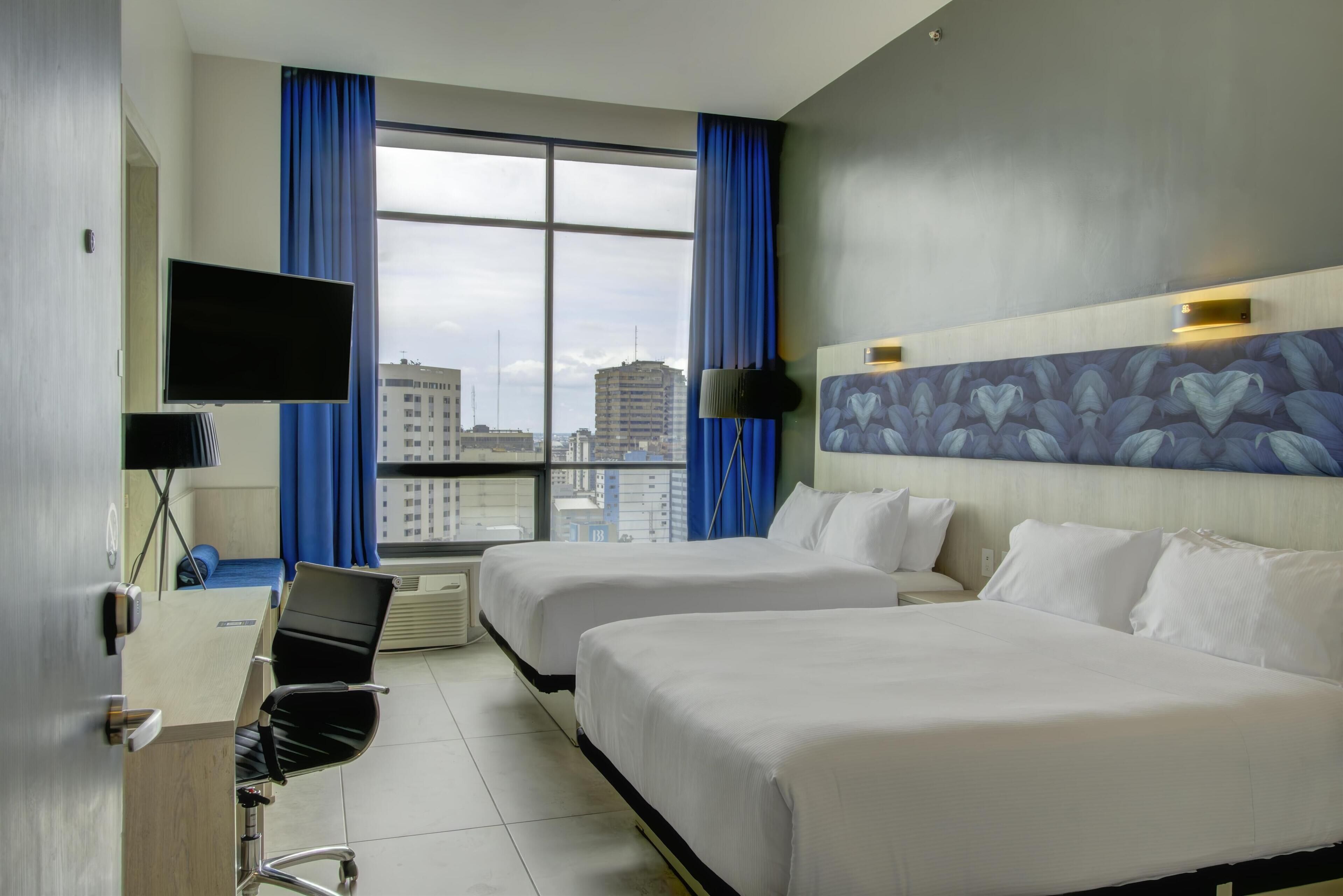 Premium Room, 2 Queen Beds (River Front) | In-room safe, desk, laptop workspace, blackout drapes