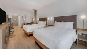 A hotel room with two beds, a desk, a chair, and a TV. - Home2 Suites By Hilton Boone (Boone)