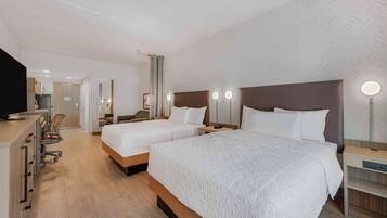 Desk, laptop workspace, bed sheets