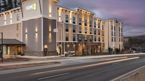 A multi-story hotel with a modern design, featuring a prominent "HOME2" sign. - Home2 Suites By Hilton Boone (Boone)