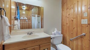 A wooden bathroom with a sink, mirror, and toilet. - Garden Studio Cabin w/ peek-a-boo views - 1 min walk to beach! (Eastsound)