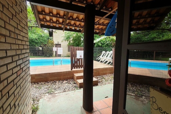 Economy Quadruple Room, Multiple Beds, Pool View, Poolside | Living area
