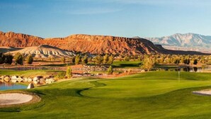 A golf course with a pond, trees, and mountains in the background. - Massive Backyard with Private Pool and Spa (Hurricane)