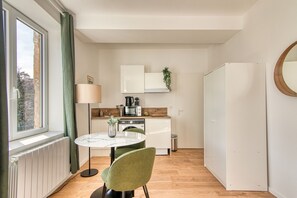 Fridge, microwave, stovetop, coffee/tea maker