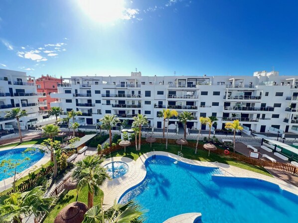 Enjoy the rooftop views and swim in one of two pools surrounded by palm trees.