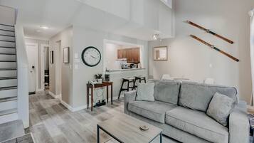 Apartment (1 Bedroom) | Living area | 55-inch Smart TV with satellite channels, ping pong