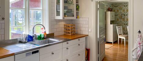 Fridge, stovetop, dishwasher, coffee/tea maker