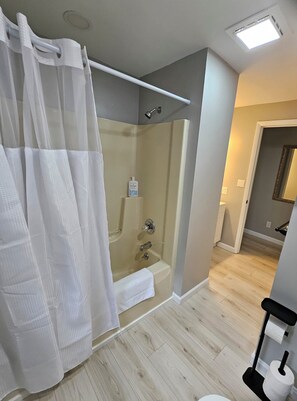 Shower, hair dryer, towels, soap