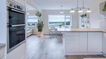 Microwave, oven, dining tables, kitchen islands