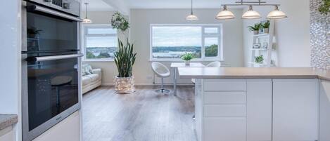 Microwave, oven, dining tables, kitchen islands