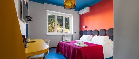 1 bedroom, desk, iron/ironing board, travel crib