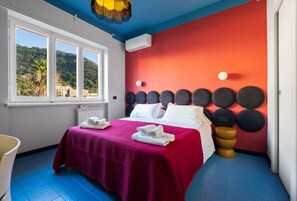 1 bedroom, desk, iron/ironing board, travel crib