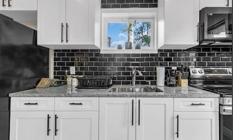 Fridge, microwave, oven, stovetop. Luxury 2BR home with high ceilings with BBQ/ patio in beautiful South Windsor.