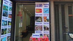 A travel agency named "Laura Travel" with a booking office, tour office, and laundry services. - Laura house (Hanoi)