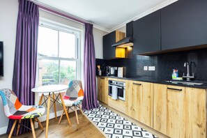 Fridge, microwave, cookware/dishes/utensils