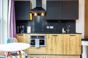 Fridge, microwave, cookware/dishes/utensils