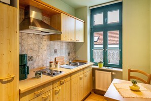 Fridge, microwave, stovetop, coffee/tea maker