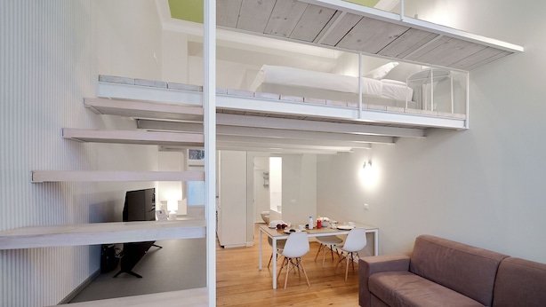 A modern loft-style apartment with a mezzanine bedroom, a dining area, and a living space. - MILAN design Loft in great location (Milan)