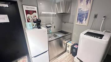 Comfort Condo | Private kitchen | Fridge, stovetop, electric kettle, cookware/dishes/utensils