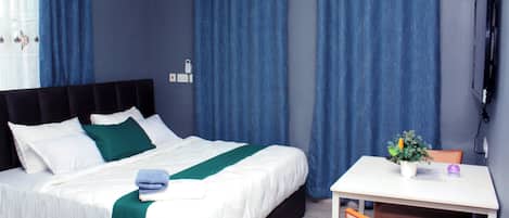 Luxury Suite, Balcony, City View | Minibar, individually decorated, individually furnished, desk