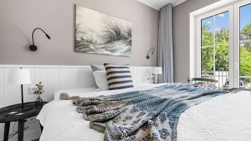 2 habitaciones, tabla de planchar con plancha y cuna de viaje
