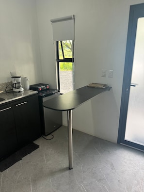 Enjoy cooking in this well-equipped kitchen with a coffee maker and sink.