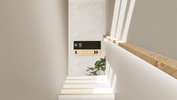 A modern staircase with a wooden handrail and a wall-mounted sign with directional arrows. - Volbs (Tabanan)