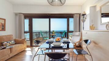 Classic Apartment, Beach View | Living area | Flat-screen TV