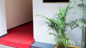A reception area with a sign for Hotel Anugraha NX on the 2nd floor. - Hotel Anugraha NX (Palghar)
