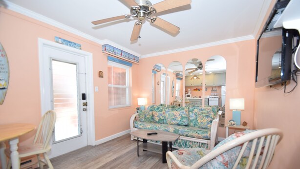 A living room with a sofa, chairs, a coffee table, and a ceiling fan. - Virginian 4-Oceanside 11th St, Free WiFi, W/D, AC (Ocean City)
