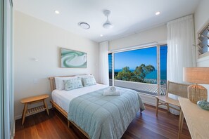 Rest easy in the second bedroom with a king bed and ocean views. - The Lighthouse: Poolside Oceanview Infinity (Airlie Beach)