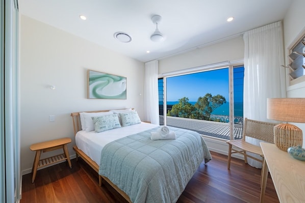 Rest easy in the second bedroom with a king bed and ocean views.