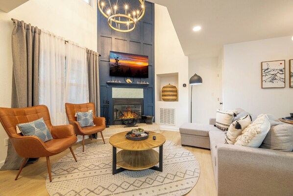 TV, fireplace - *Stunning 2BD Cabin w/ Hot Tub! Pool Access + Sauna* (Gatlinburg)