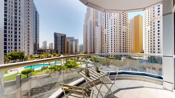A high-rise residential building with a rooftop pool and lounge area. - The Point Tower - Vibrant One Bed in Marina (Dubai Marina)