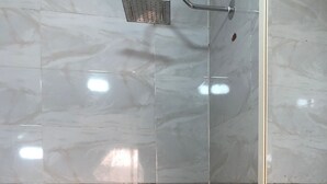 A bathroom with a shower, toilet, and sink. - Pyramids Third Eye (Giza)