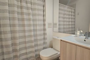 Apartment | Bathroom | Shower, towels, toilet paper