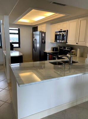Private kitchen - Beach Front Condo , heated pool. renovated building, gym..
Prices vary monthly. (Marco Island)