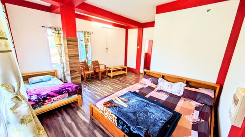 TRIPLE BED DELUXE ROOM