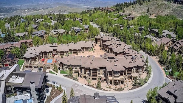 A residential area with a central building surrounded by houses, roads, and greenery. - Private Residence 3 in Park City (Park City)