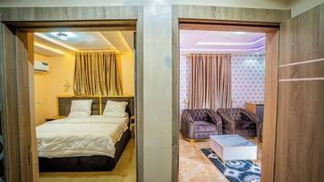 Deluxe Room, Balcony, City View | Desk, laptop workspace, free WiFi