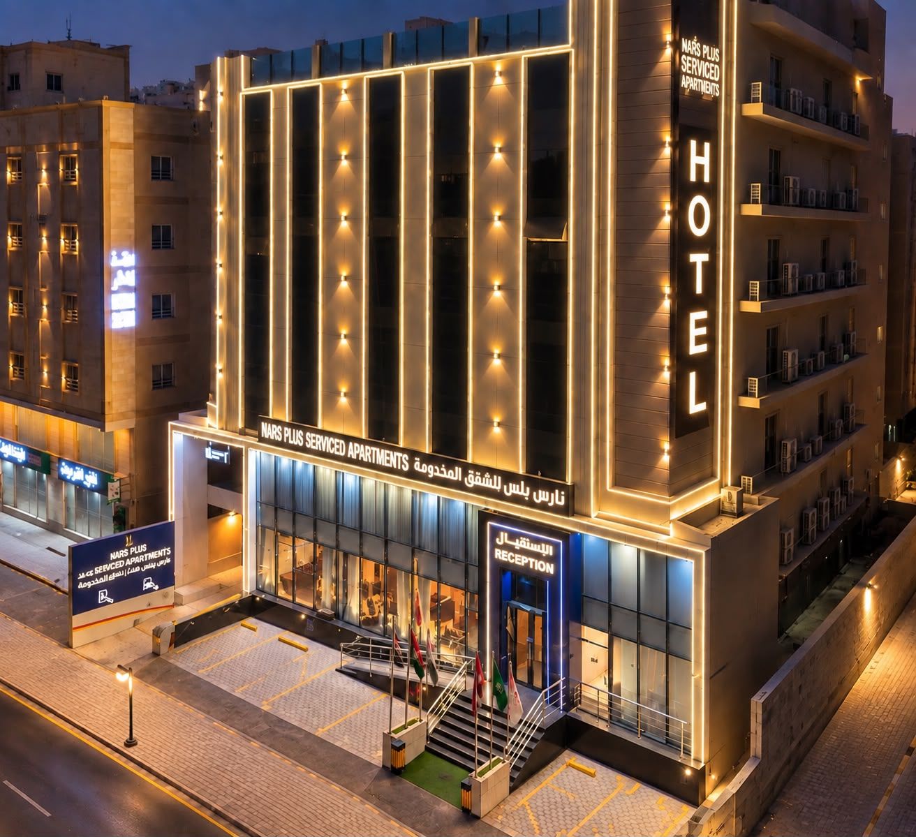A hotel with a modern facade, multiple floors, and a prominent reception area.