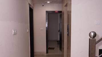 Economy Double Room | Living area | 13-inch LCD TV with cable channels