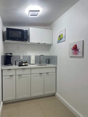 Microwave, stovetop, coffee/tea maker, toaster