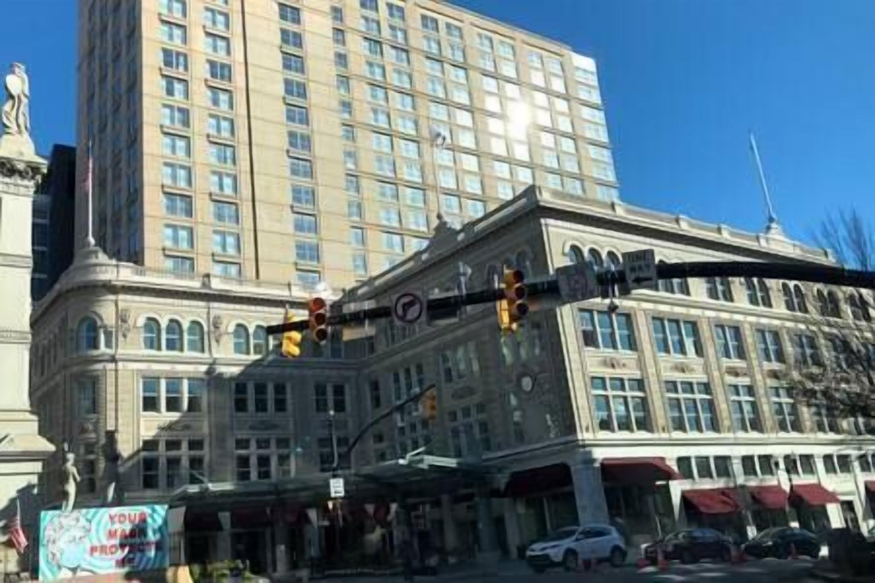 A multi-story building with large windows and a corner entrance.