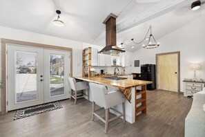 Luxury Studio Suite, 1 King Bed, Mobility Accessible | Private kitchen | High chair, cookware/dishes/utensils - The Culinary Quarters (Sequim)