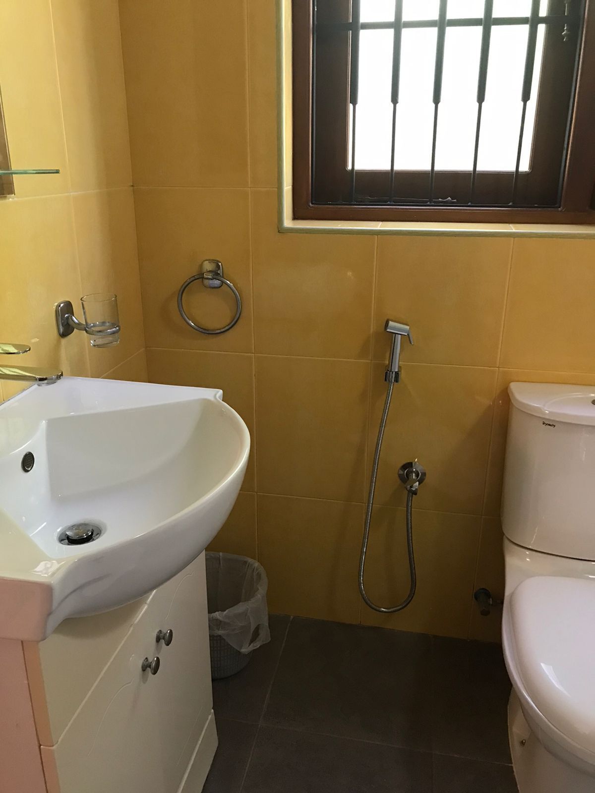A bathroom with a sink, toilet, and shower.