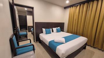 Deluxe Quadruple Room, Multiple Beds, Non Smoking, Private Bathroom | Down comforters, pillowtop beds, laptop workspace, free WiFi