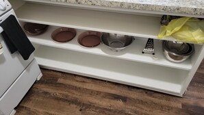 A kitchen with a granite countertop, a stainless steel sink, and a white cabinet below. - Luxury 1 bedroom, 1 Bath apt. in the middle of downtown Detroit w/parking spot!  (Detroit)