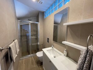 Shower, hair dryer, towels, soap